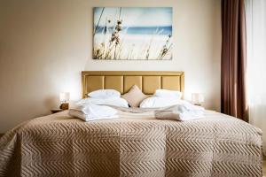 Posteľ alebo postele v izbe v ubytovaní Land-Plan Hotel