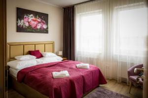 Posteľ alebo postele v izbe v ubytovaní Land-Plan Hotel