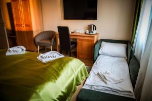 Posteľ alebo postele v izbe v ubytovaní Land-Plan Hotel