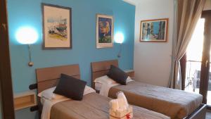 Postel nebo postele na pokoji v ubytování Rainbow Sweet Rooms