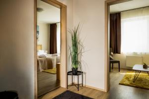 Posteľ alebo postele v izbe v ubytovaní Land-Plan Hotel