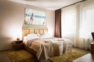 Posteľ alebo postele v izbe v ubytovaní Land-Plan Hotel