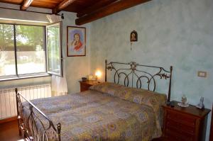A bed or beds in a room at Villa Ninfea