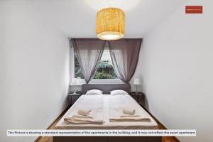 Ein Bett oder Betten in einem Zimmer der Unterkunft Spacious Apartment in Zurich