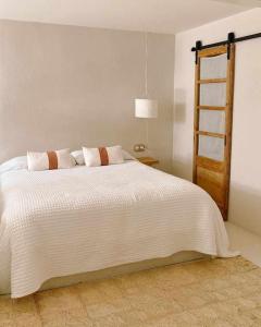 Katil atau katil-katil dalam bilik di Estudio L'Oliveta by LohodiHomes