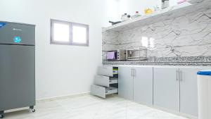 Cuisine ou kitchenette dans l'établissement Résidence America
