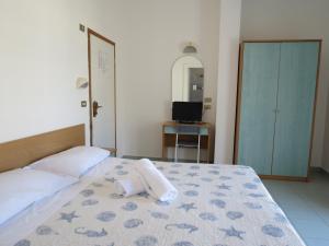 Postel nebo postele na pokoji v ubytování Hotel Gemini