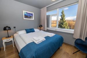 Llit o llits en una habitació de Hotel Kjarnalundur- Aurora Dream - Lodges and Rooms