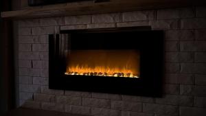a brick fireplace with a fire in it at Deluxe Studio 200m from Ski Road in Bansko