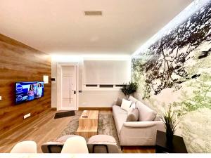 Μια τηλεόραση ή/και κέντρο ψυχαγωγίας στο Apartamentos Albamar-Nuevos-Redomeira-Premium