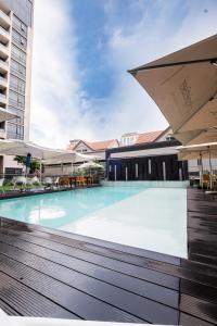 an empty swimming pool in a building at Masingita Towers - Luxurious Apartment Condo in Sandton in Johannesburg