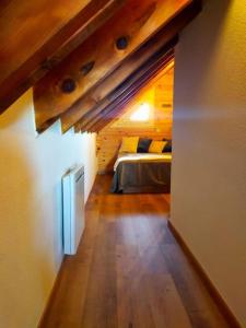 a bedroom with a bed in a room at Le Nid Mansardé in Ustou +46 photos