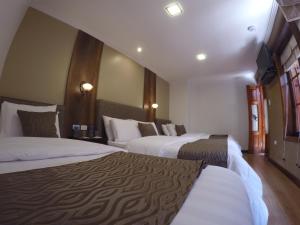 Cama ou camas em um quarto em Siena Hotel