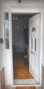 a door leading into a room with a hallway at Maison du Lac in Kastoria