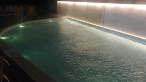 Swimmingpoolen hos eller tæt på Barra Home Stay Flat