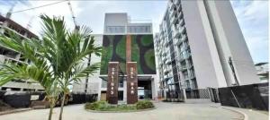 a large building with a sign in front of it at Amazing 2BR Apartament with pool in Santa Marta in Santa Marta
