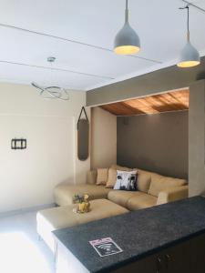 a living room with a couch and a table at onCactus Luxury Penthouse in Empangeni
