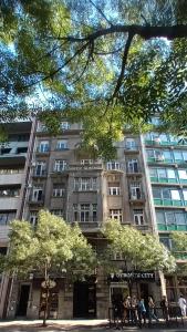 a large building with people standing in front of it at 15 PERCENT OFF UNTIL 31st OF AUGUST ABC Luxury Space with 7 suites for 15 Guests - One Suite with Hot Tub and Sauna, Paid Parking on-site, Mandatory Reservation in Belgrade