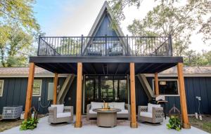 a house with a deck with a patio at Luxury 3bd 3bth sleeps 10 gorgeous and brand new in Bryan