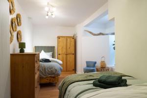 Ένα ή περισσότερα κρεβάτια σε δωμάτιο στο Bona - Principality Stadium - City Centre -Cardiff