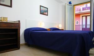 Postelja oz. postelje v sobi nastanitve Casa Trinacria Taormina