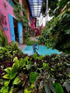 a swimming pool in the middle of a garden at Hospedaria Santa Bárbara in Rio de Janeiro