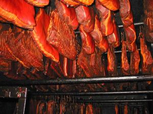 a bunch of meat being cooked on a grill at Gasthof Zum Schützen in Oberprechtal