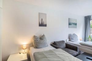 Ένα ή περισσότερα κρεβάτια σε δωμάτιο στο Ideal für die Entdeckerfamilie