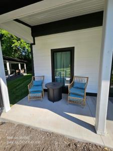 two chairs and a table on a patio at Life's Especially Good Retreat in Brevard