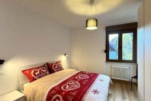 Ένα ή περισσότερα κρεβάτια σε δωμάτιο στο Appartamento Wald Residence