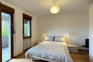 Ένα ή περισσότερα κρεβάτια σε δωμάτιο στο Appartamento Wald Residence