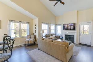 a living room with a couch and a fireplace at Wichita Townhome with Patio 9 Mi to Downtown! in Wichita