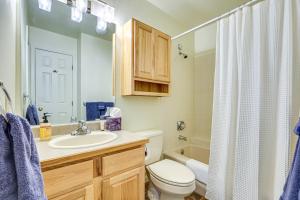 a bathroom with a sink and a toilet and a shower at Copper Mtn Resort Duplex with Golf Course Views! in Frisco +16 photos