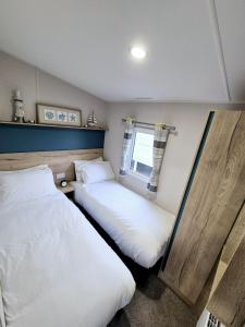 Postel nebo postele na pokoji v ubytování Whitstable Neptune