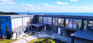 an apartment building with a view of the ocean at Kaze no iro Bijutsukan - Vacation STAY 67833v in Asahi
