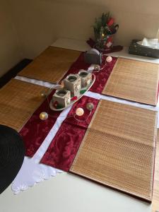 a table with two cutting boards and a pair of scissors at Gemütliche Ferienwohnung in Burg bei Magdeburg +9 photos