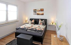 Ένα ή περισσότερα κρεβάτια σε δωμάτιο στο Ferienhaus Wolgastmahlzow