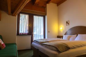 Postel nebo postele na pokoji v ubytování Chalet La Felce