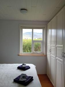 Postel nebo postele na pokoji v ubytování Hóll Guesthouse