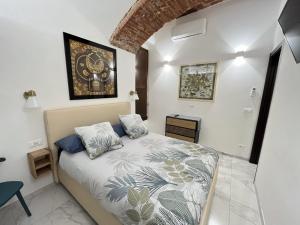 Ένα ή περισσότερα κρεβάτια σε δωμάτιο στο IL POSTO CHE NON TI ASPETTI centro storico