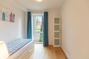 Ένα ή περισσότερα κρεβάτια σε δωμάτιο στο Theos Garten