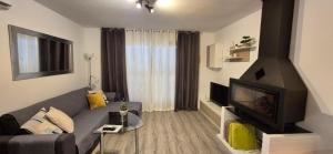 A television and/or entertainment centre at Apartment Hibiscus