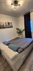 A bed or beds in a room at Apartment Hibiscus Még 14 kép
