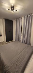 A bed or beds in a room at Apartment Hibiscus