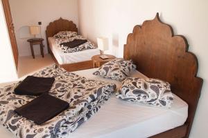 two beds in a room with two beds sidx sidx sidx at Lair De La Mer Resort Hotel in Sidi Kaouki +5 photos