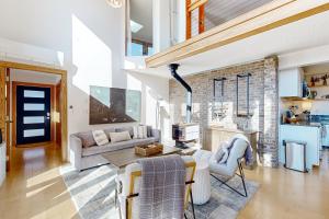 a living room with a couch and a table at Blue Mountain Retreat in Weaverville