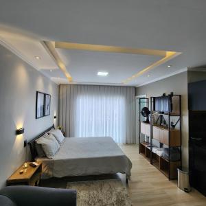 Postel nebo postele na pokoji v ubytování Solar Itaipava Studios