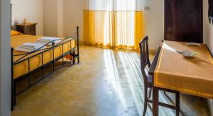 A bed or beds in a room at B&B La Garolla