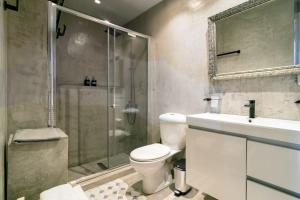 a bathroom with a shower and a toilet and a sink at Diamond apartment in Athens