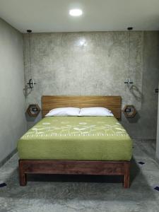 a bedroom with a bed in a room at Casa Lomas Grangelo in Atlixco